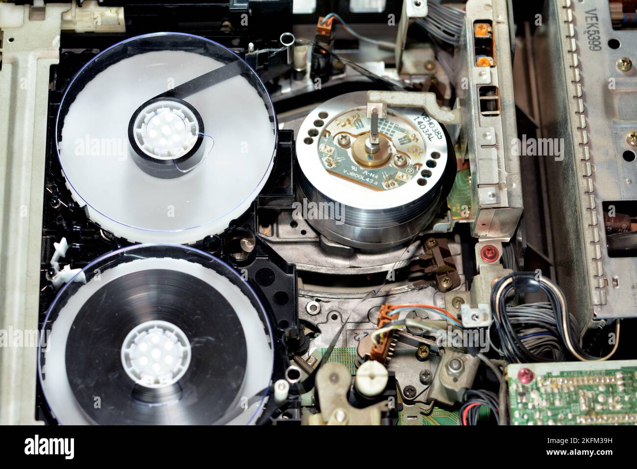 Cairo, Egypt, October 19 2022: Selective focus of the interior of an old obsolete VHS video recorder and player with its electronics and magnetic head Stock Photo