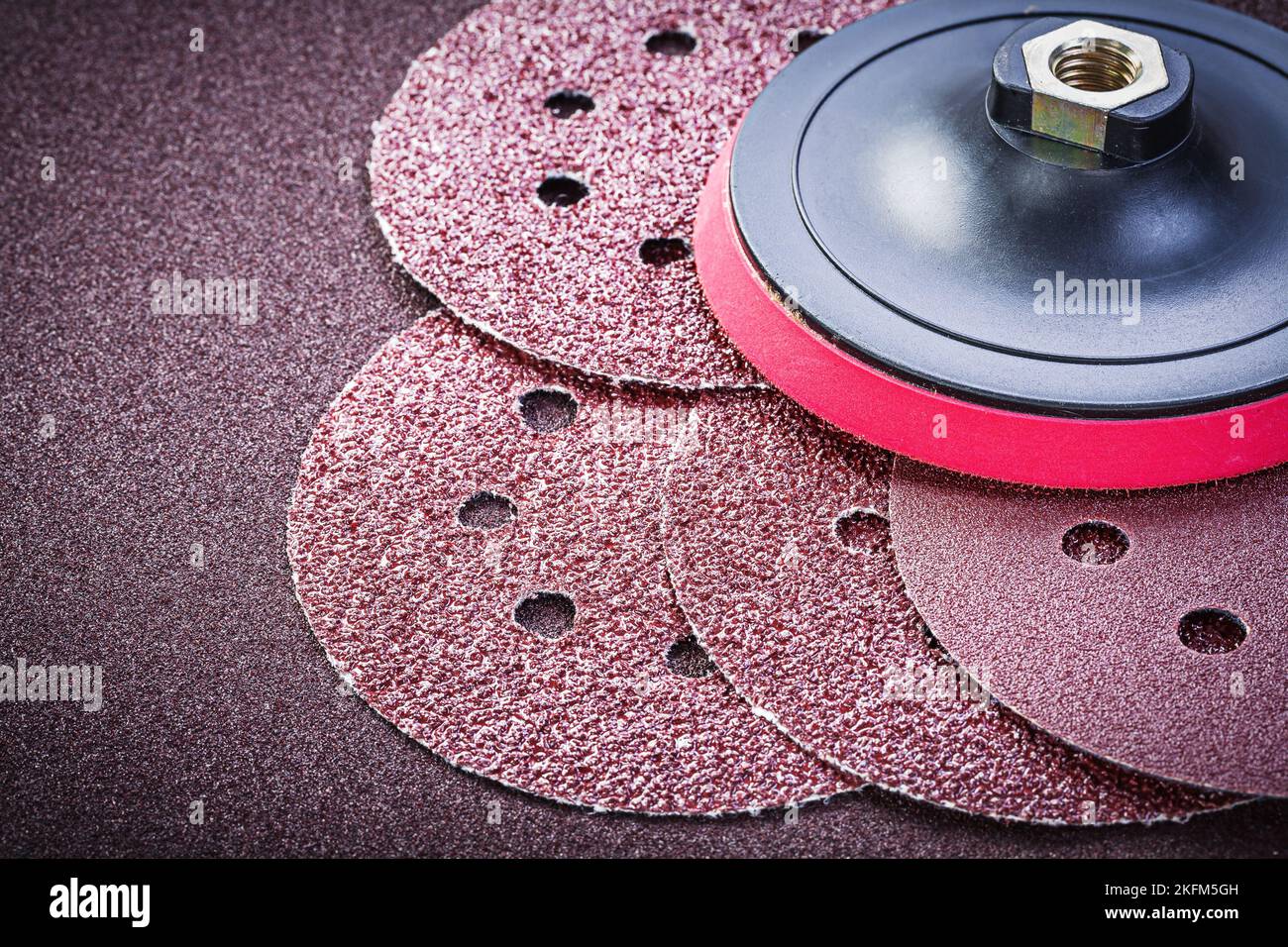 Grinding discs holder on sandpaper sheet abrasive materials Stock Photo