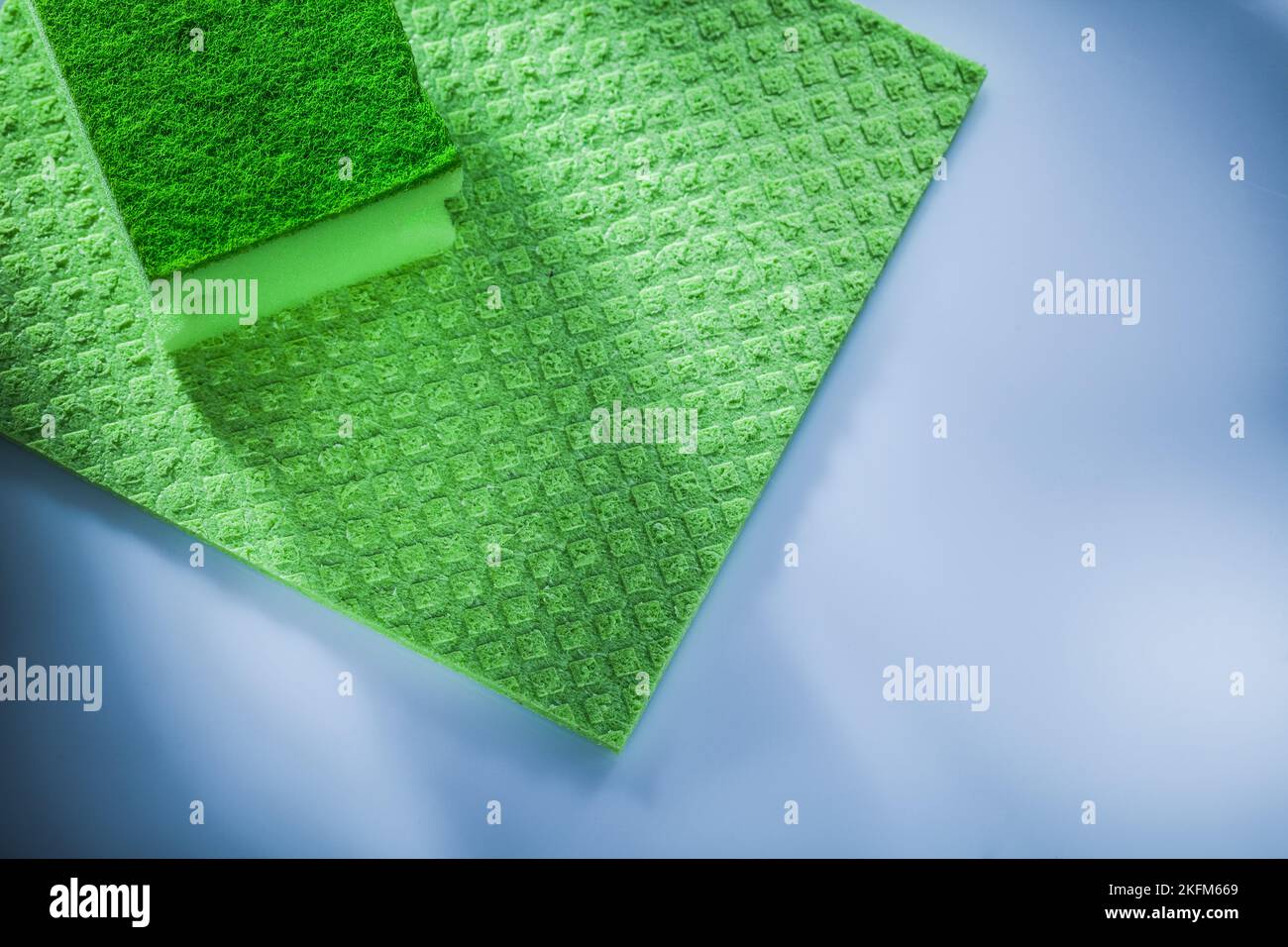Household washcloth sponge on white surface. Stock Photo