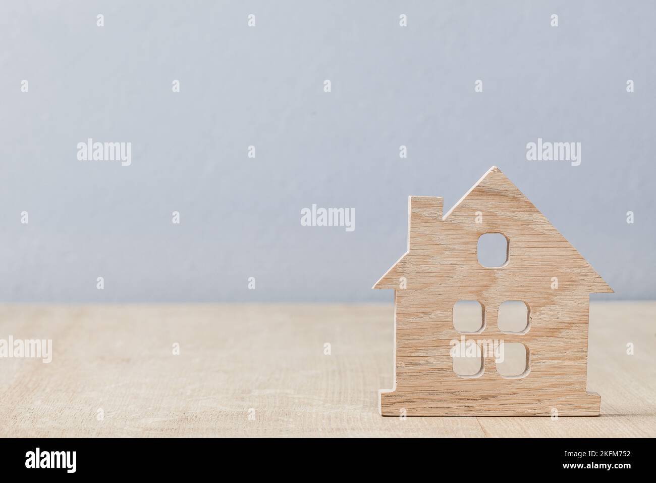 little model toy symbol of house on wood background Stock Photo