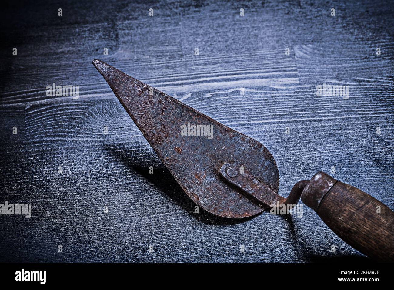 old rusted putty knife on board Stock Photo Alamy