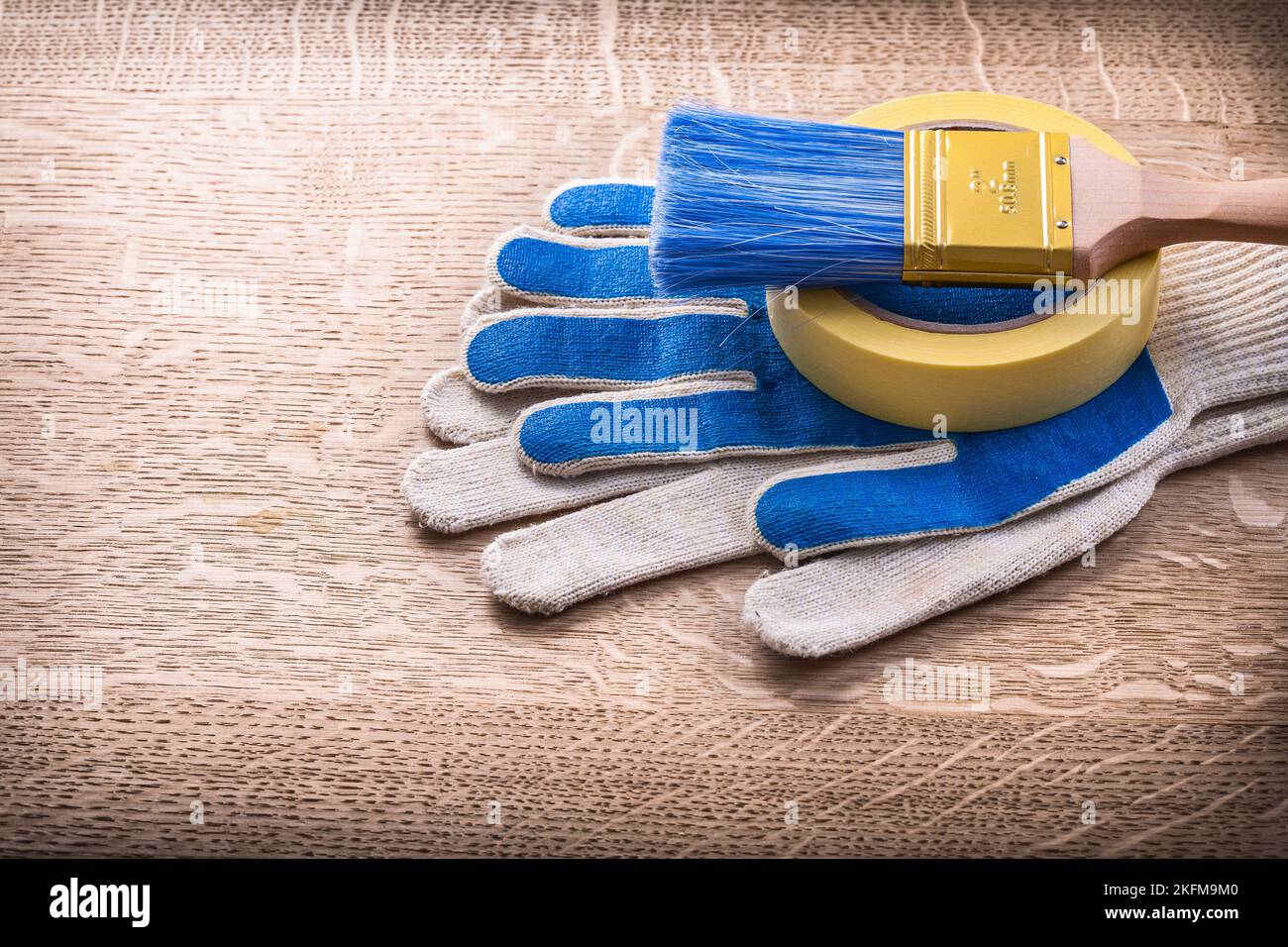 paint brush on duct tape and gloves Stock Photo Alamy