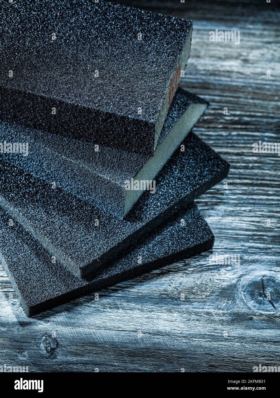 Polishing sanding blocks on vintage wooden board. Stock Photo