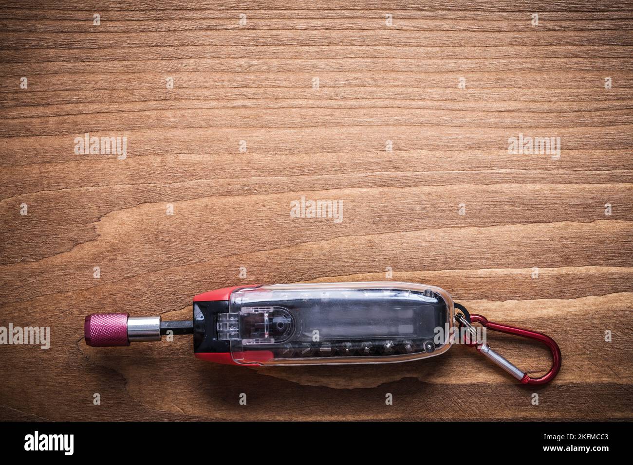 Replaceable screwdriver bits in toolbox on wooden board construction concept. Stock Photo