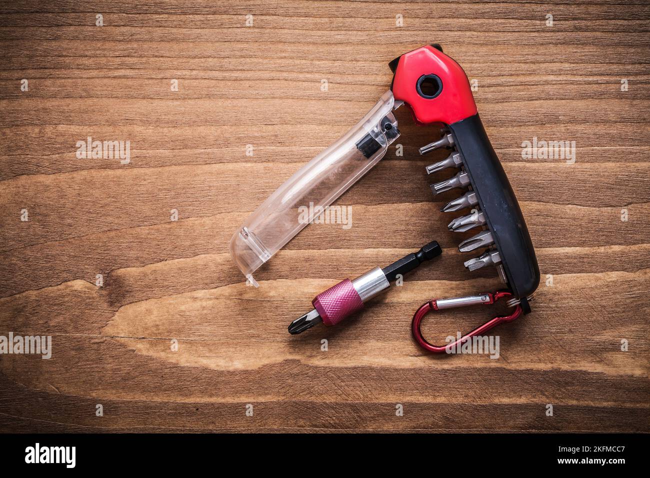 Replaceable turnscrew bits in toolbox on wooden board construction concept. Stock Photo