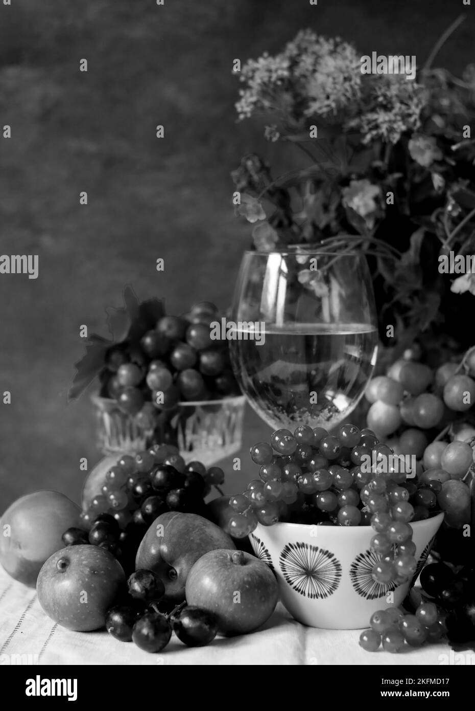 Still life with wine and fruit. Black and white photography Stock Photo