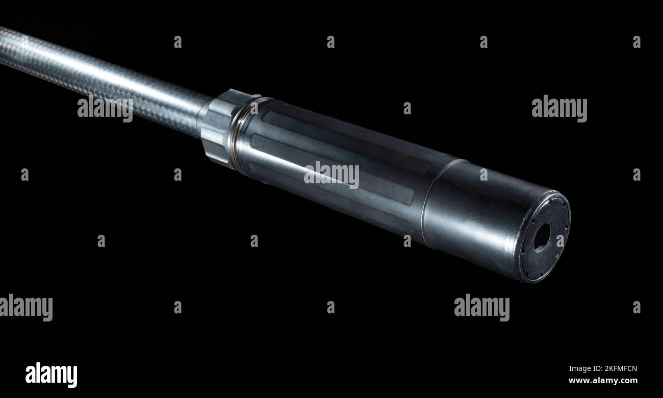 Silencer mounted on a rifle on a black background Stock Photo - Alamy