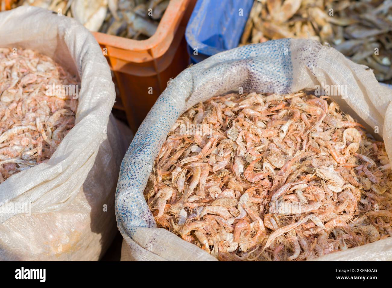dried shrimps or krills kept in a sack in fish markets of india Stock