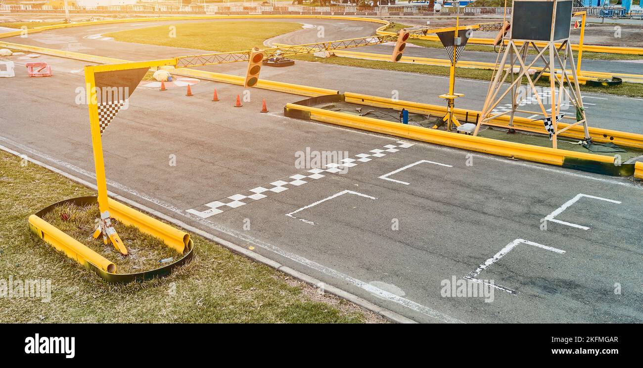 Aerial top view of the go-kart track from the drone. Kart racers drive ...