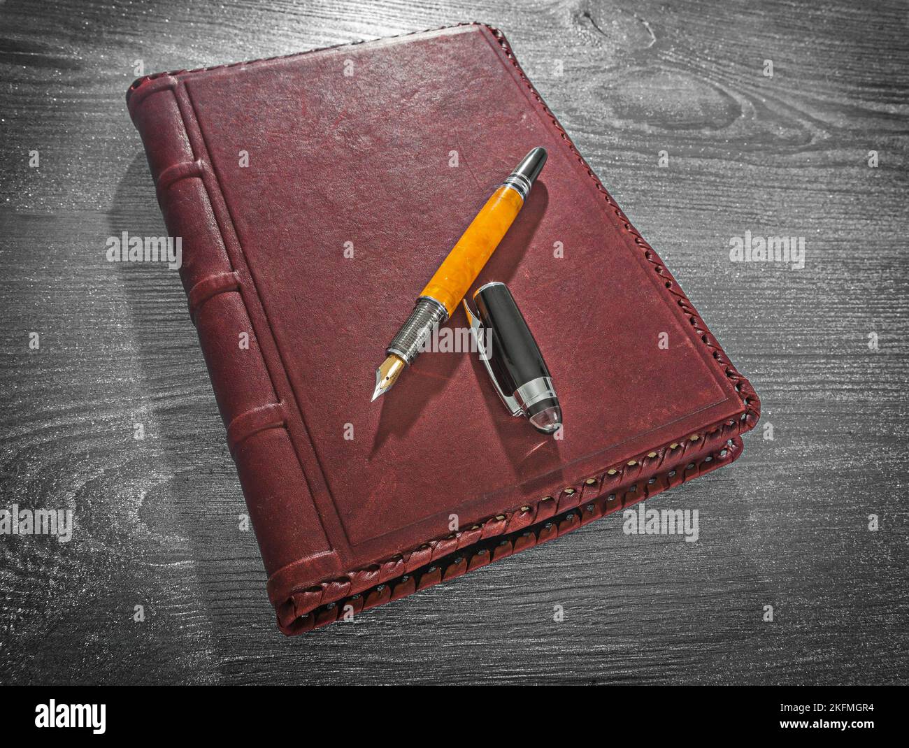 view on vintage leather notepad and opened fountain pen Stock Photo Alamy
