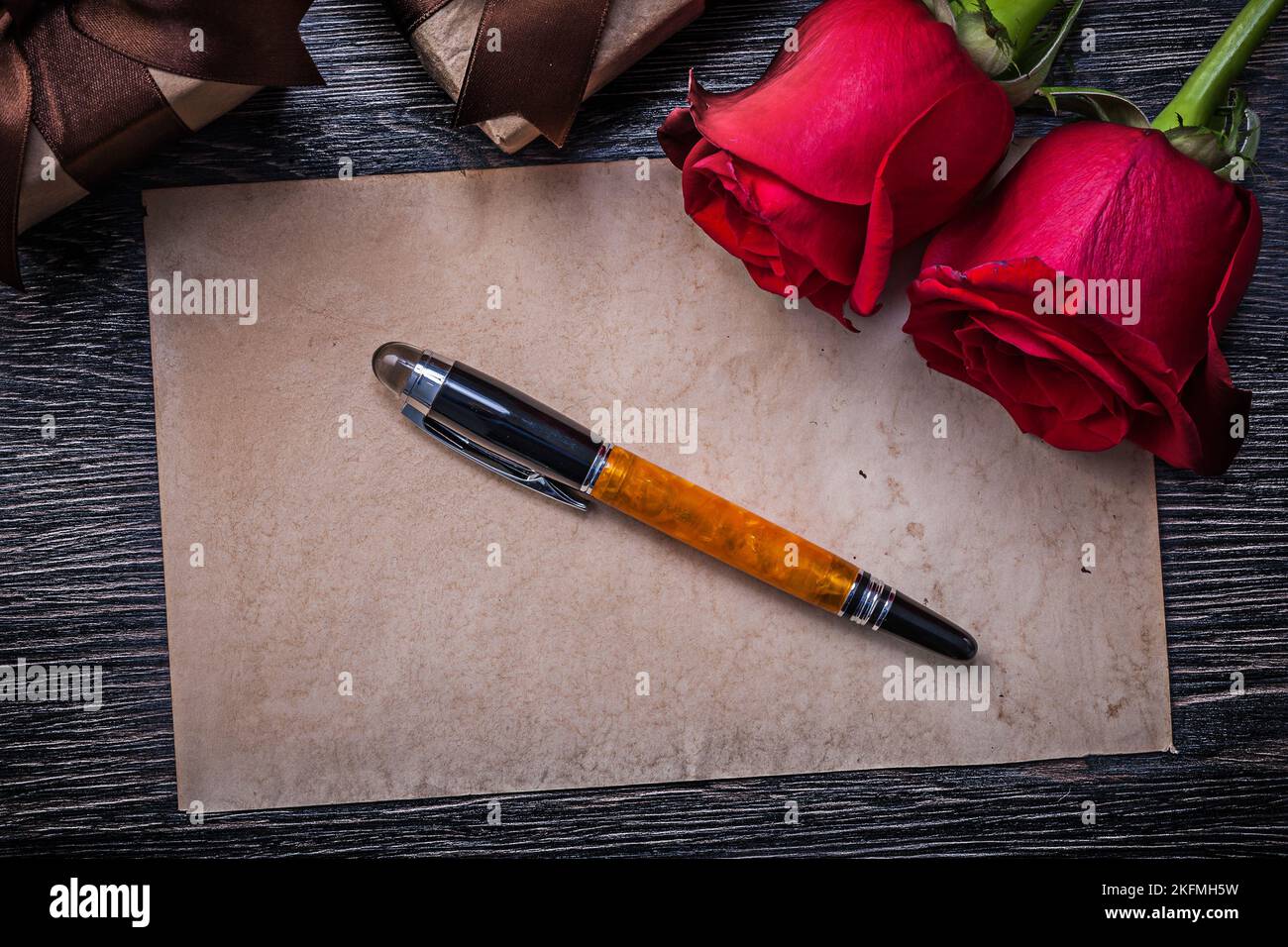 Vintage paper red roses present boxes fountain pen Stock Photo Alamy