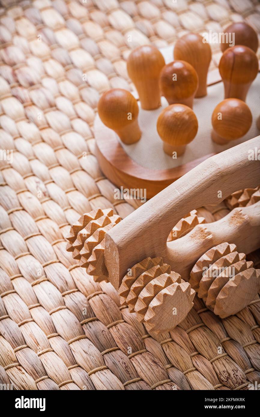 Wooden refreshing massager on wicker mat healthcare concept Stock Photo