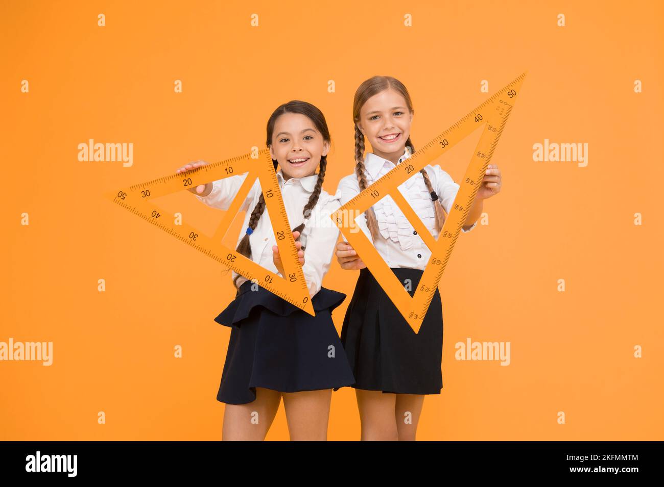 Pupil Using Ruler Pupil school girls big rulers. School knowledge. Explore world with ...