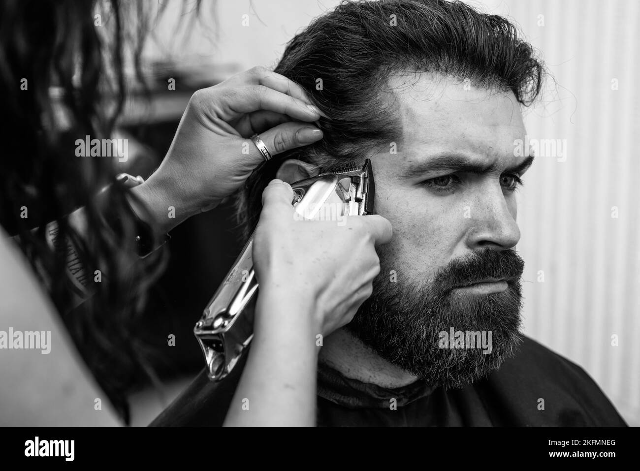 hair cut and beard care for caucasian guy in haircare Stock