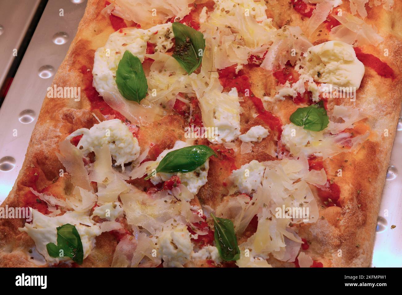 Italian focaccia called ROMAN PINSA with basil cheese and red tomato sauce Stock Photo Alamy
