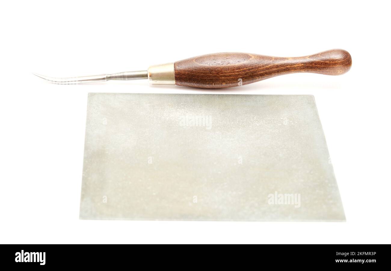 Curved burnisher tool used in engraving, isolated on white background