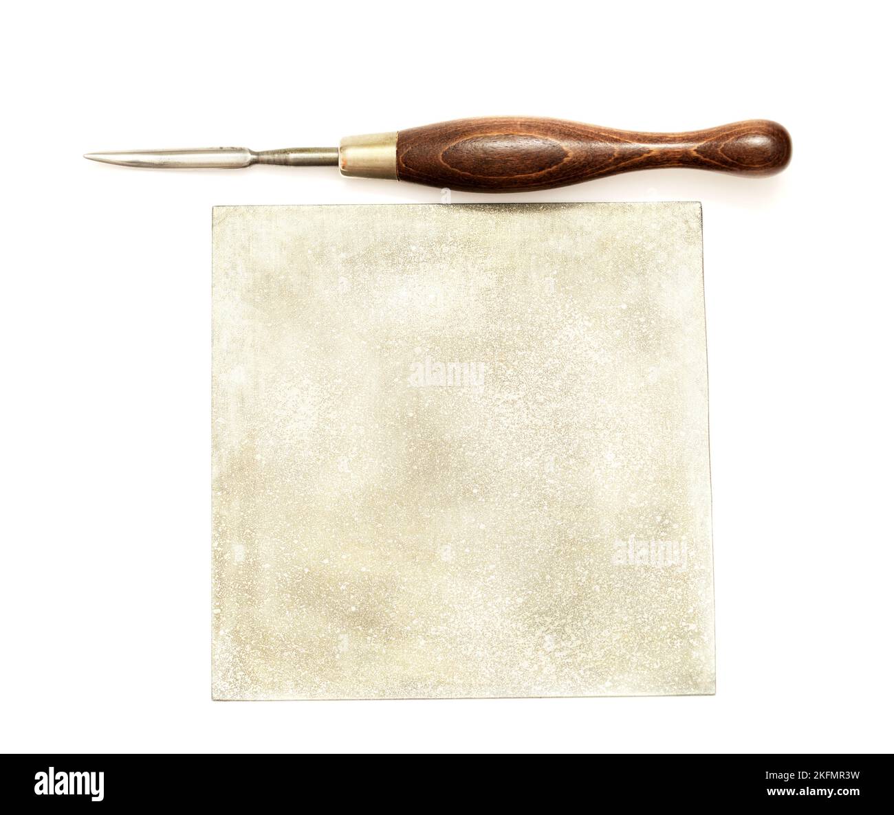 Curved burnisher tool used in engraving, isolated on white background