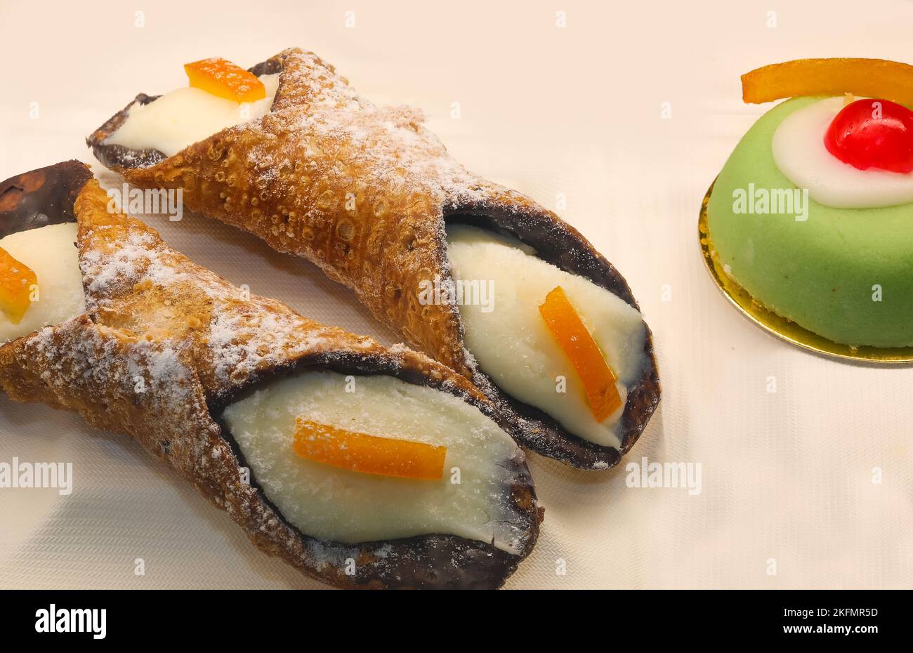 typical products of Sicilian pastry from southern Italy with cannoli and candied fruit Stock Photo