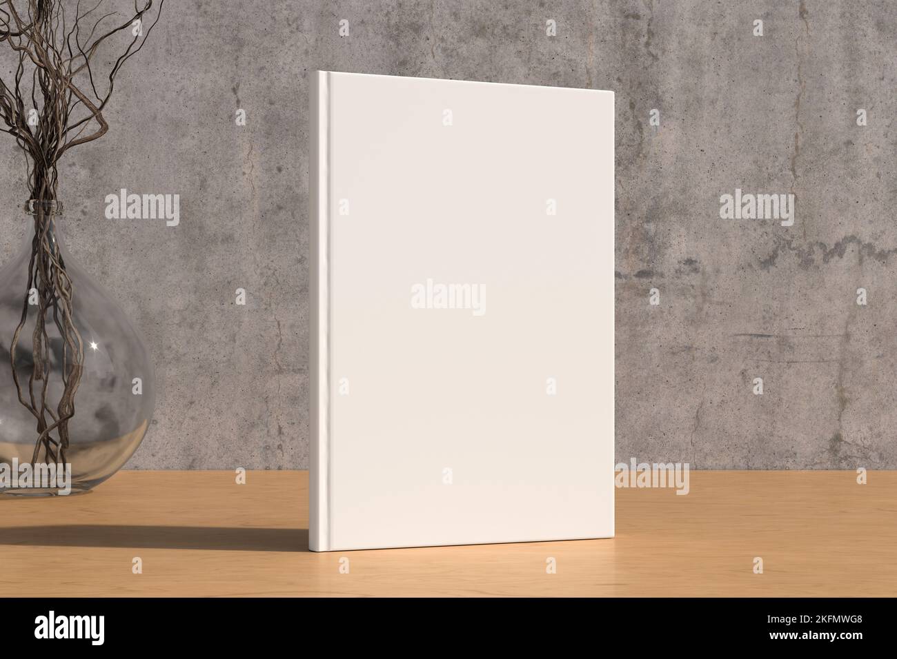 Vertical book cover mock up standing on a wooden desk with concrete wall background Stock Photo