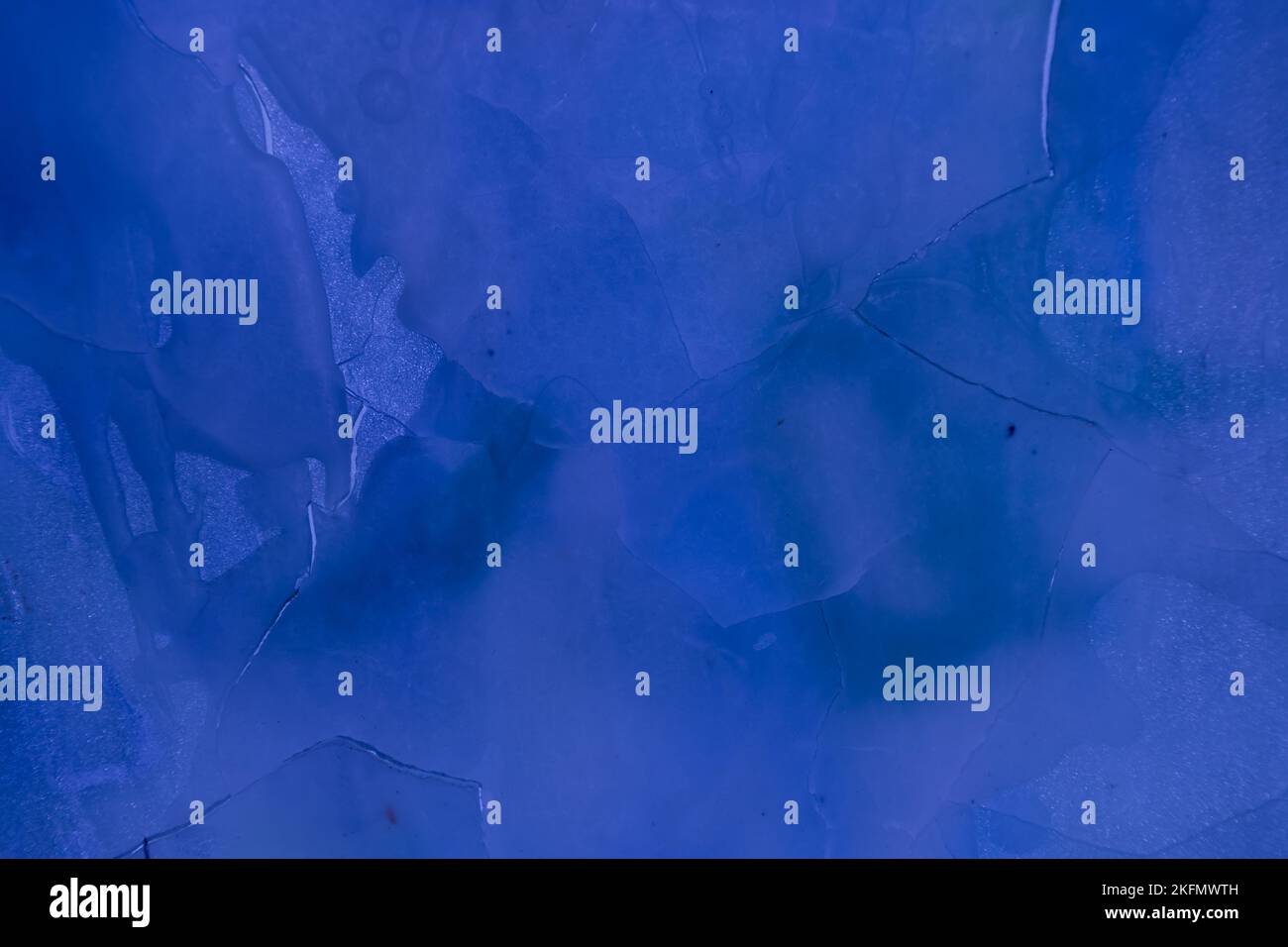 Blue stained and cracked frosted glass texture for background Stock Photo