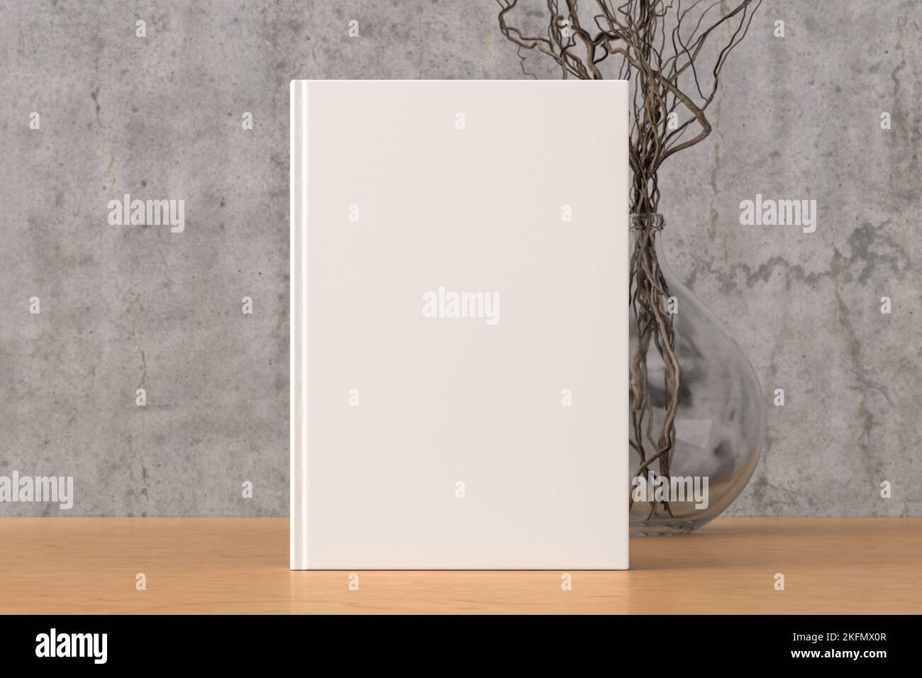 Vertical book cover mock up standing on a wooden desk with concrete wall background Stock Photo