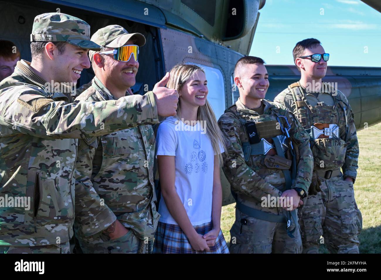 Air Crew from the 54th Helicopter Squadron pose for a photo with a student at Glenburn Public School, North Dakota, Sept. 27, 2022. The 54th Helicopter squadron coordinated with the school to arrange a landing and allow students the opportunity to tour the UH-1N Huey. Stock Photo