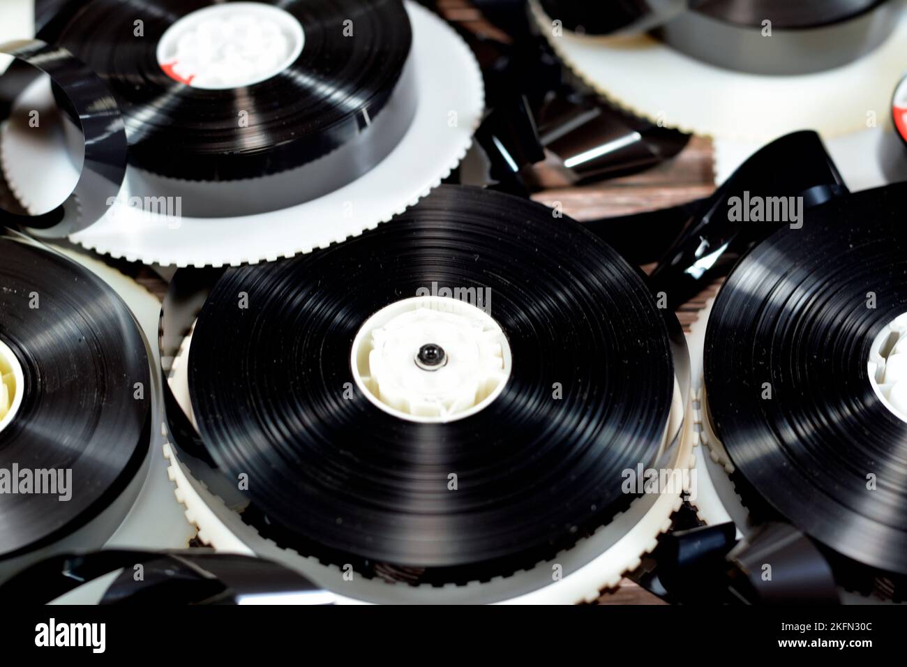 Tape ribbons with the supply and take up reels of VHS video cassette