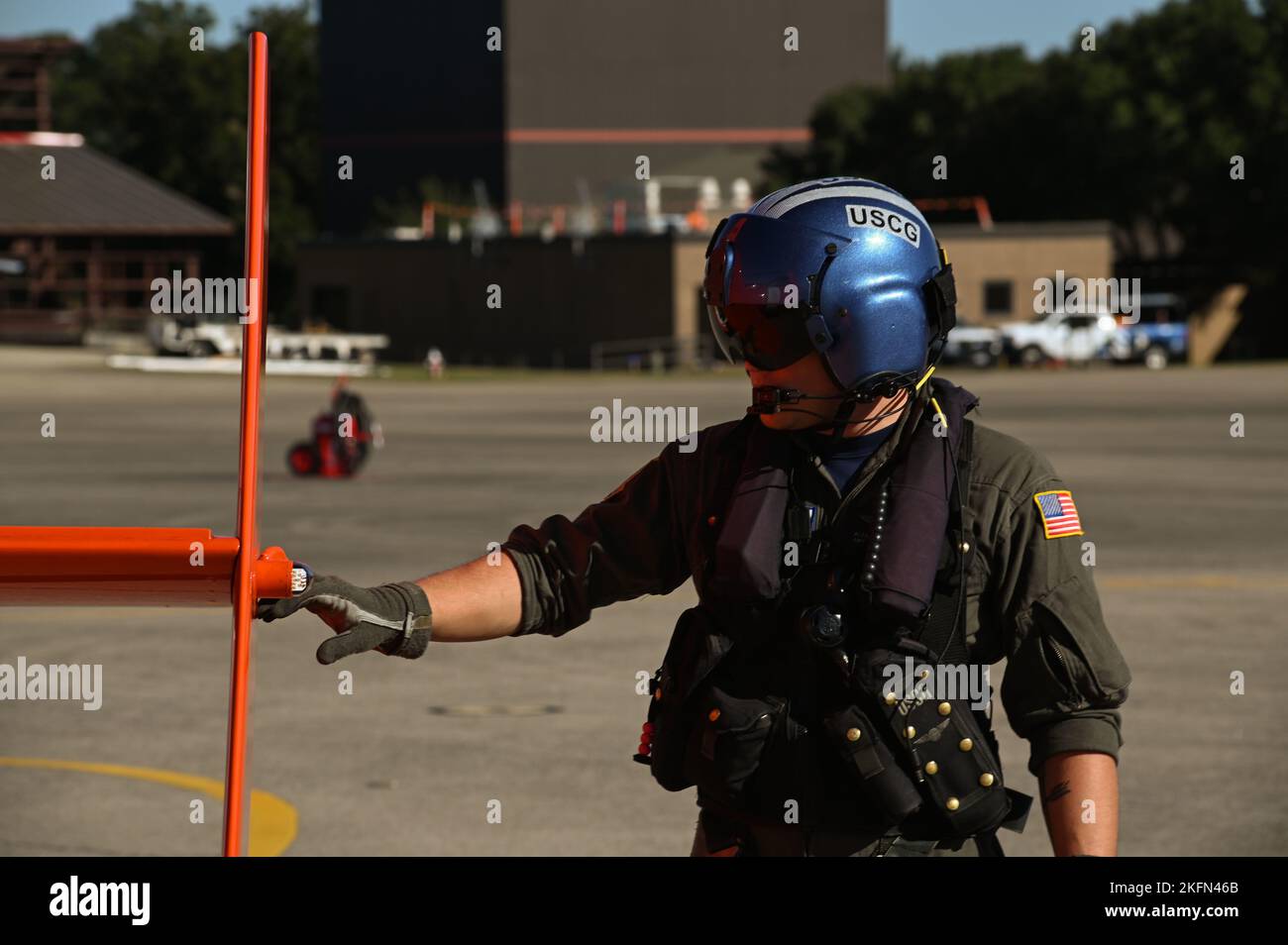 A Coast Guard Aviation Training Center Mobile pilot conducts a pre-flight inspection prior to a training flight in preparation for storm response operations Sept. 28, 2022 in Mobile, Alabama.  Coast Guard assets are being staged outside of the predicted path of Hurricane Ian at Aviation Training Center Mobile Alabama. Stock Photo