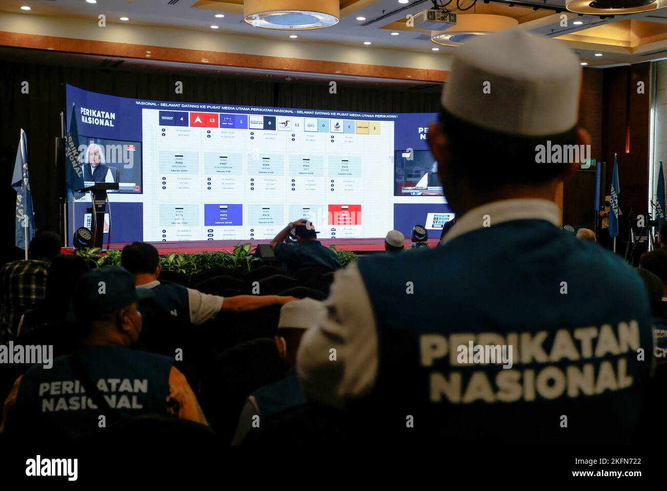 Supporters of Perikatan Nasional watch a video stream for live results of Malaysia's 15th general election at a hotel in Shah Alam, Malaysia November 19, 2022. REUTERS/Lai Seng Sin Stock Photo