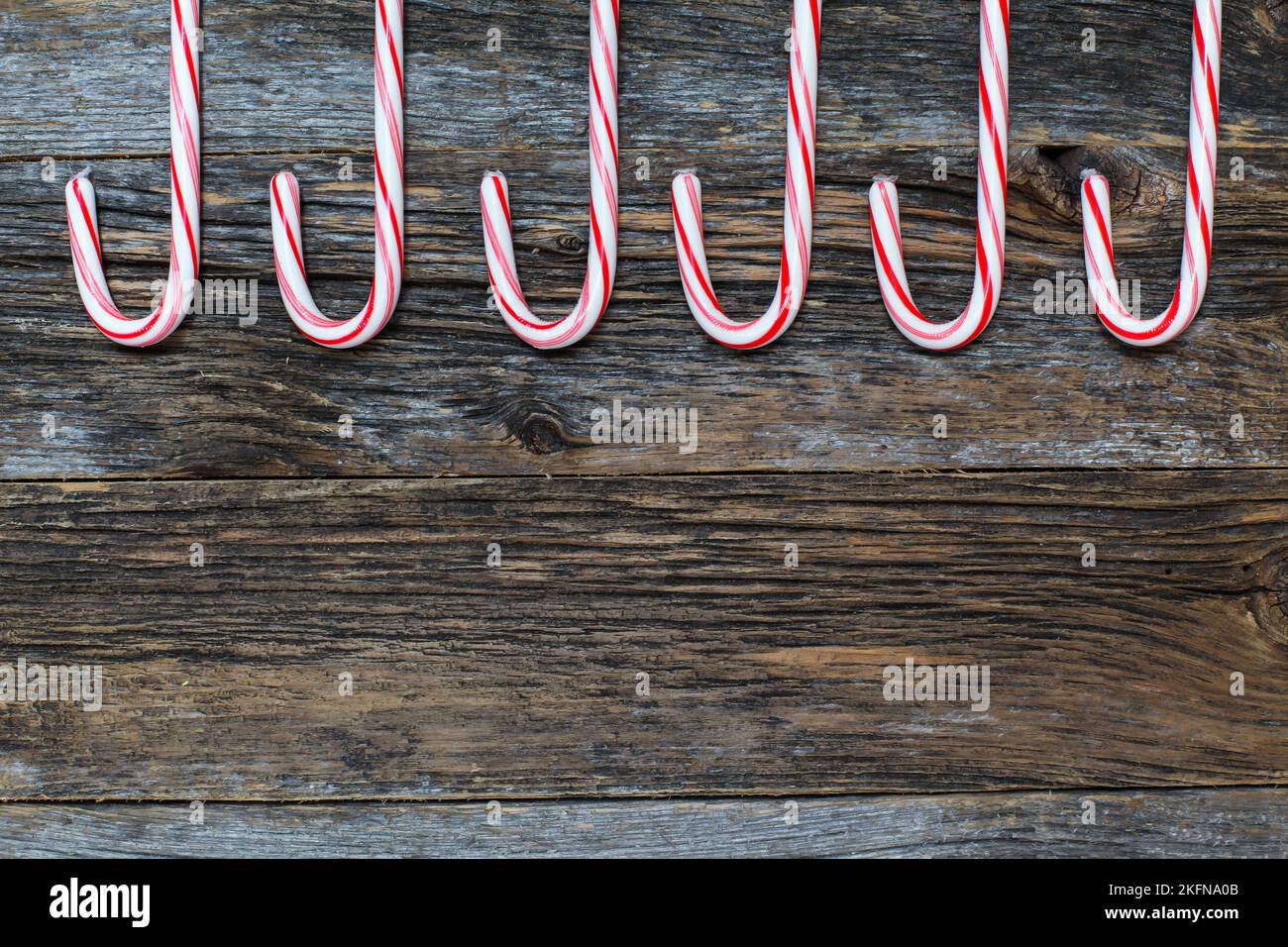 Rustic wood with candy canes Stock Photo Alamy