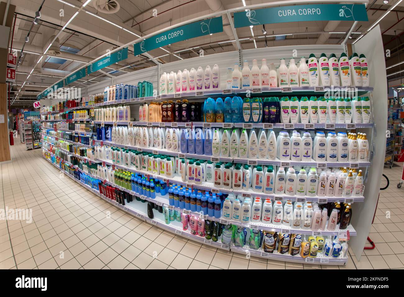 Cuneo, Italy - November 18, 2022: shelves with vast assortment of body care products, bubble baths and creams in Italian supermarket, fish eye vision Stock Photo