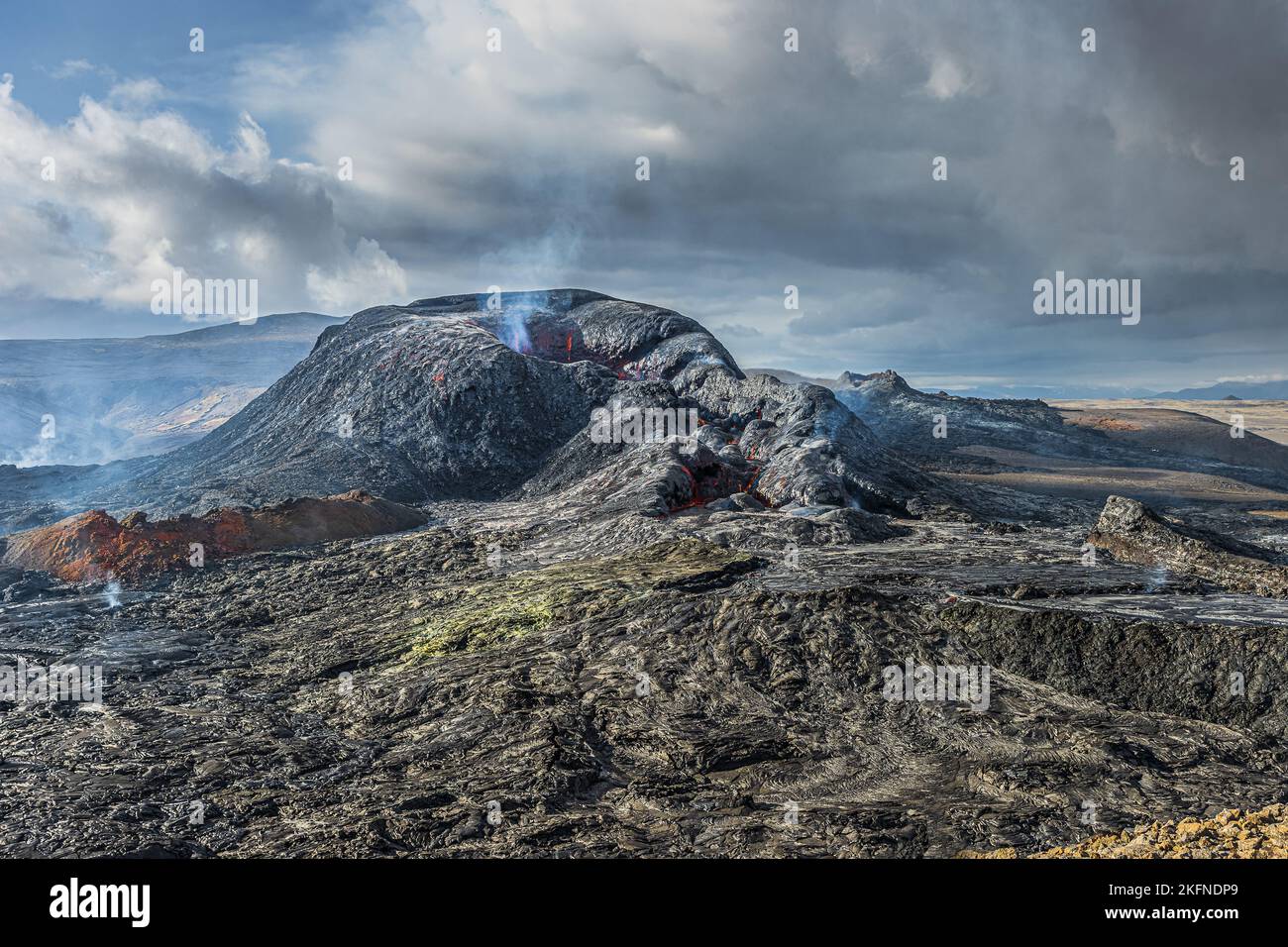 Volcanic landscape in Iceland of Reykjanes Peninsula. Steam rises from ...