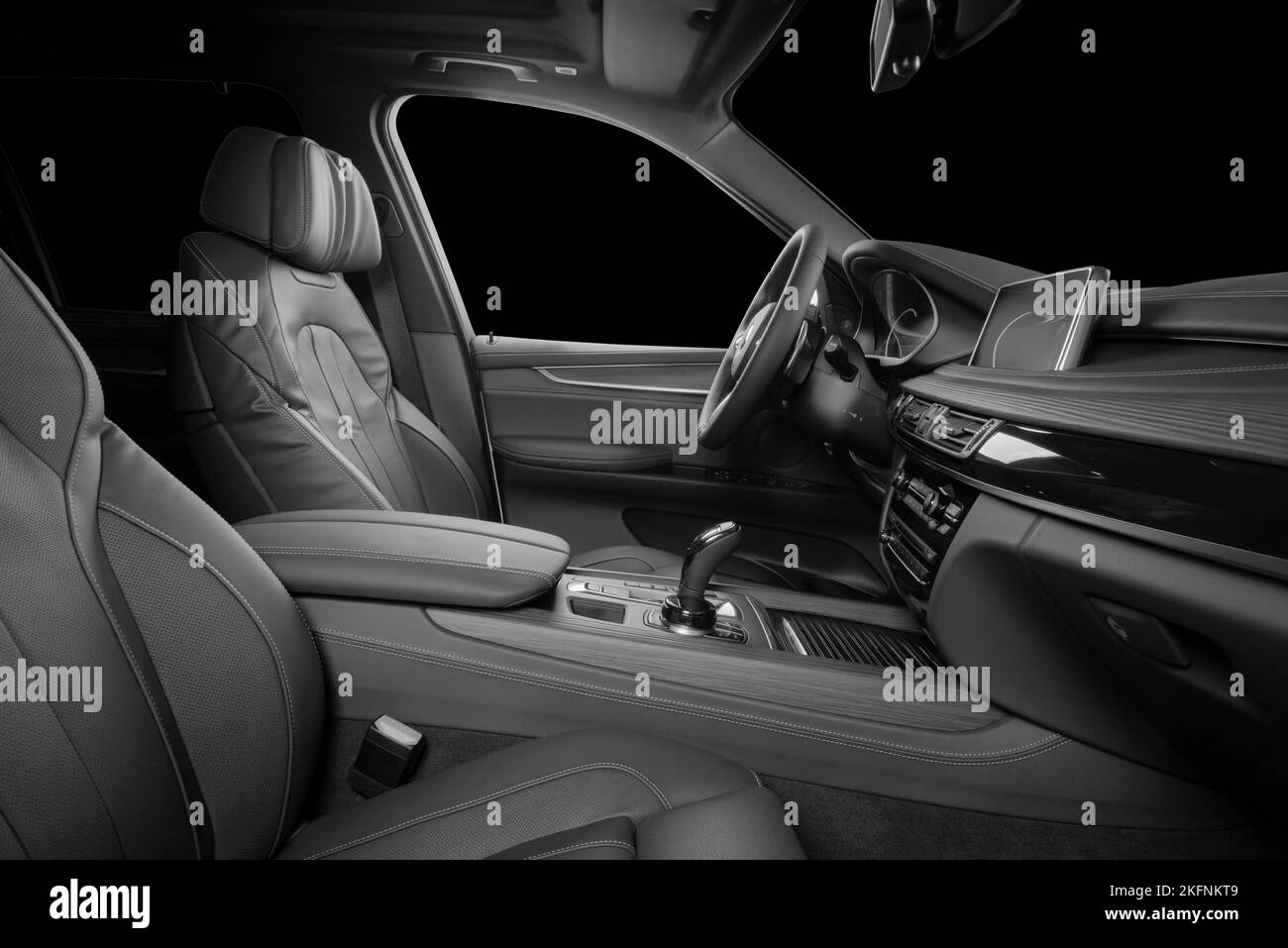 Black and whute luxury car inside Interior - steering wheel, shift lever and dashboard. Stock Photo