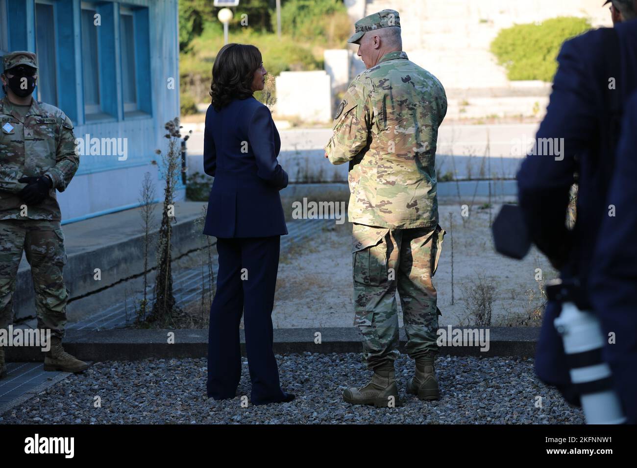 U.S. Vice President Kamala Harris and U.S. Gen. Paul LaCamera stand next to the demarcation line at the demilitarized zone in Panmunjom, South Korea, Sept. 29, 2022. The demarcation line is the official border marker separating South and North Korea. Stock Photo