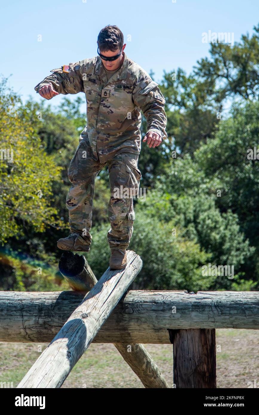 Sergeant 1st Class Jason E. Pate, 68W Combat Medics, 187th Medical Battalion, makes his way down the Easy Balance obstacle during the best medic competition, Sep. 29, 2022 at Joint Base San Antonio-Camp Bullis, Tx. The event included the Army Combat Fitness Test, obstacle course, M-4 qualification, warrior tasks and battle drills, land navigation, a Tactical Combat Casualty Care assessment and 12-Mile Ruck March. Stock Photo