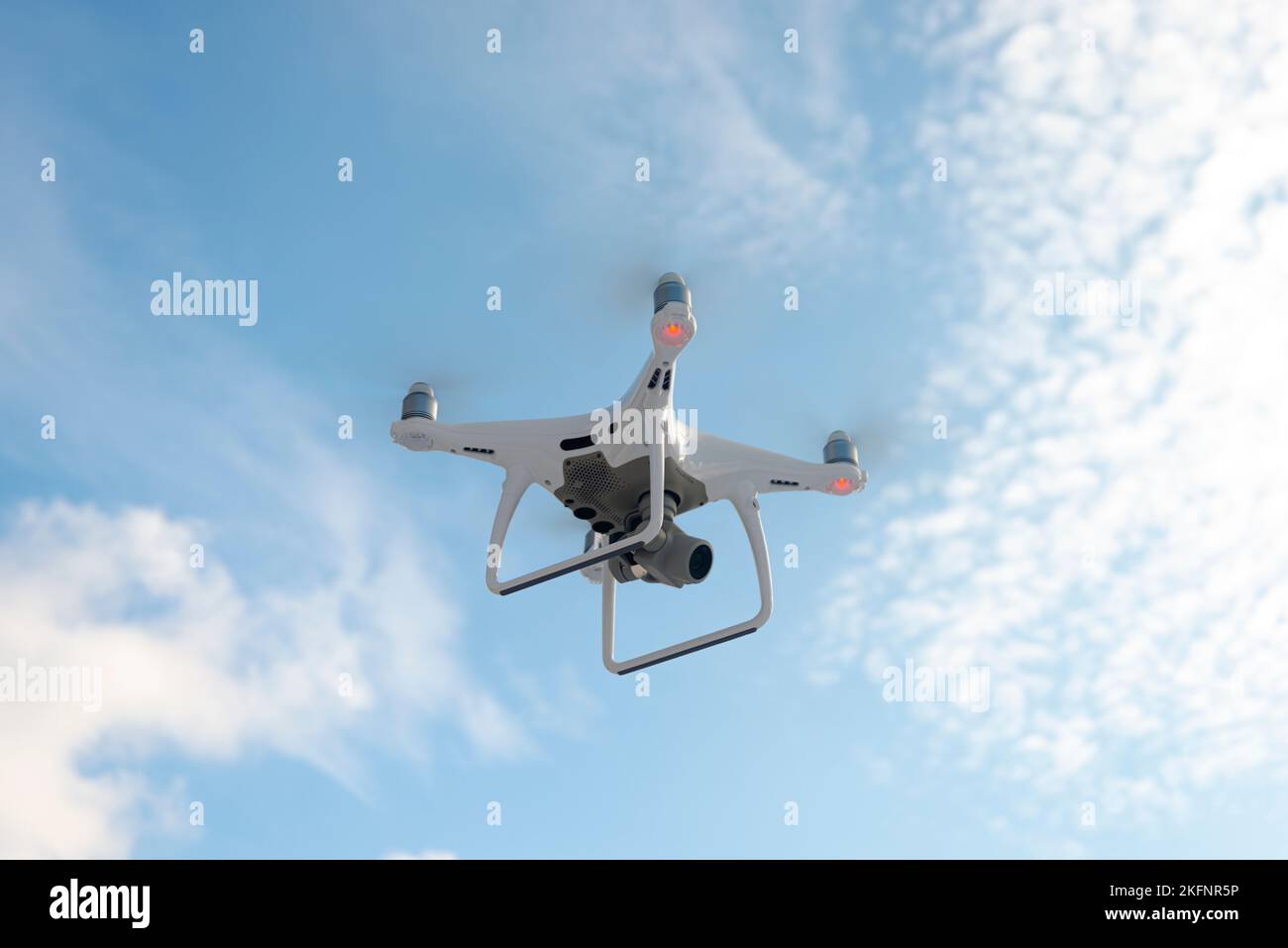 Sankt-Petersburg, Russia, March 12, 2018: The New Aircraft DJI Phantom 4 pro quadcopter drone with 4K video camera and wireless remote controller flyi Stock Photo