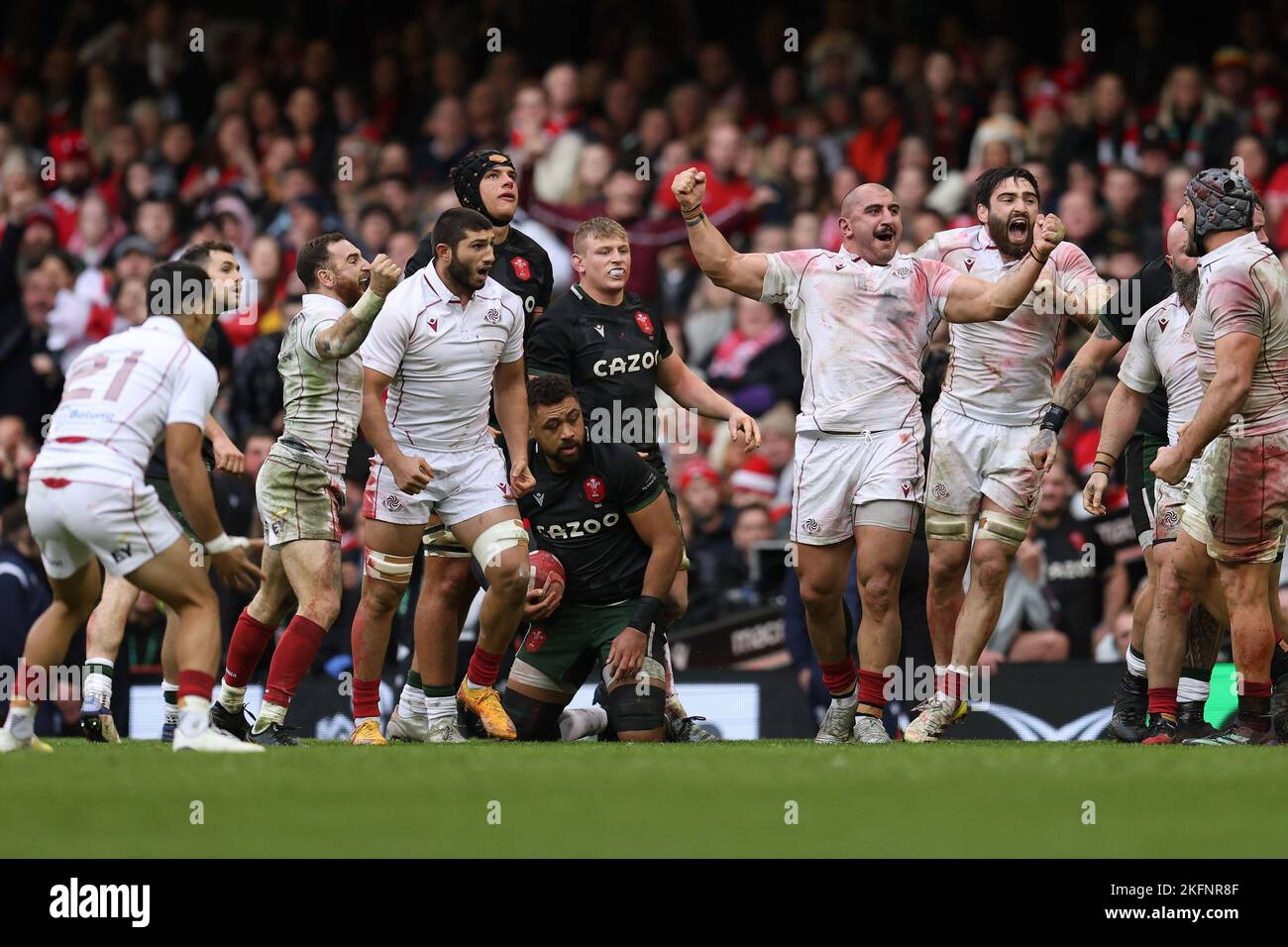 Cardiff, UK. 19th Nov, 2022. Taulupe Faletau of Wales (on ground) looks dejected as Georgia players start to celebrate their win. Autumn nations series 2022 rugby match, Wales v Georgia at the Principality Stadium in Cardiff on Saturday 19th November 2022. pic by Andrew Orchard/Andrew Orchard sports photography/Alamy Live News Credit: Andrew Orchard sports photography/Alamy Live News Stock Photo