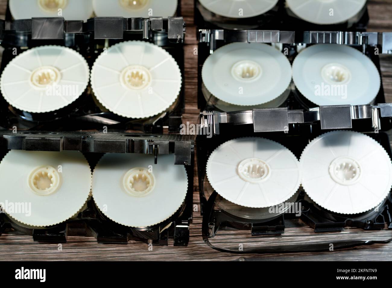 Pile of VHS video cassette tape from inside with the front casing