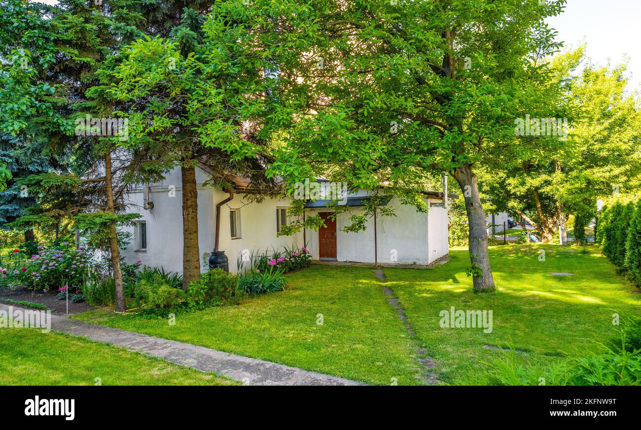 Warsaw, Poland June 26, 2022 Vintage village house and yard squeezed