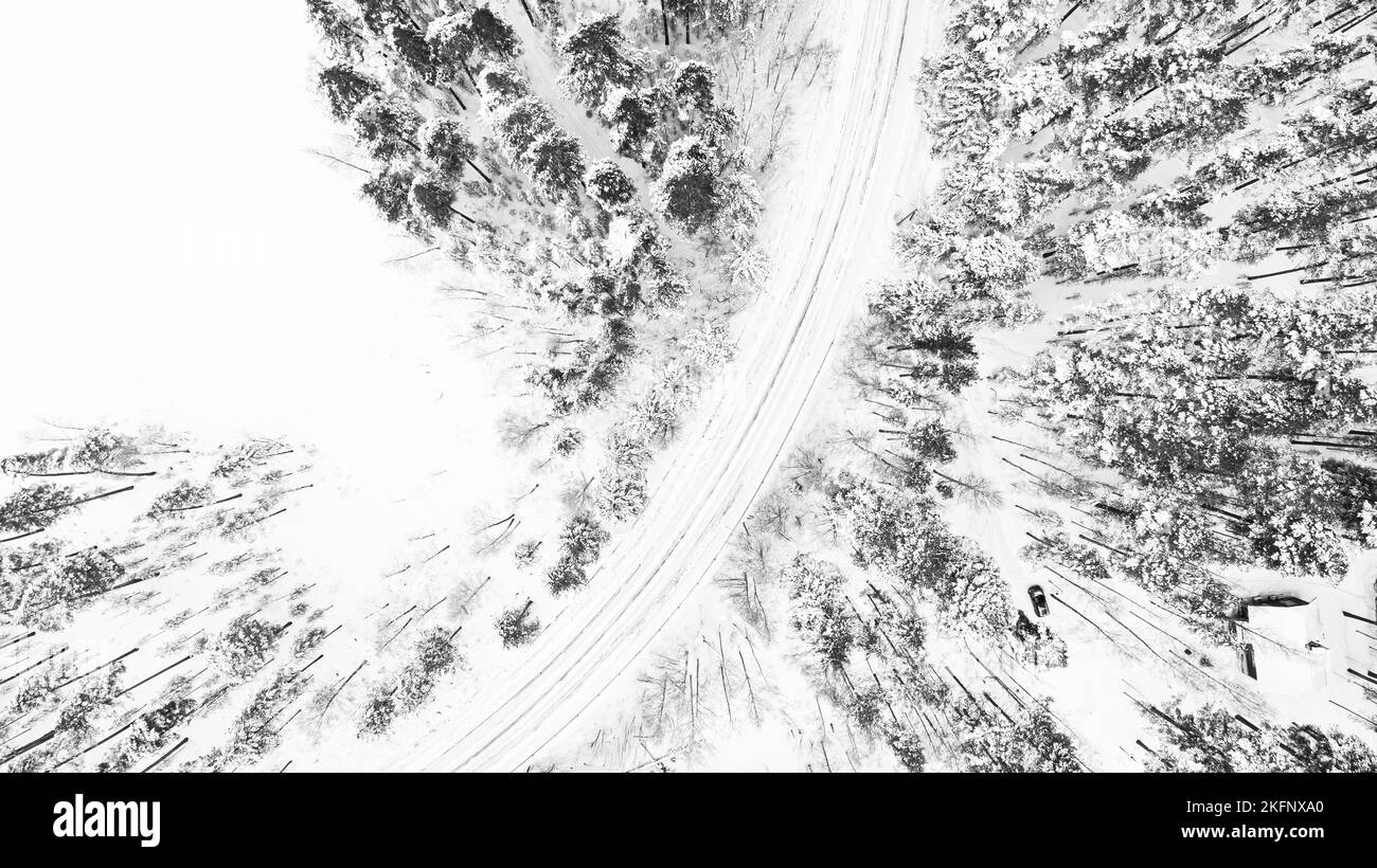 Winter snow covered pine forests and road bird's eye view Stock Photo