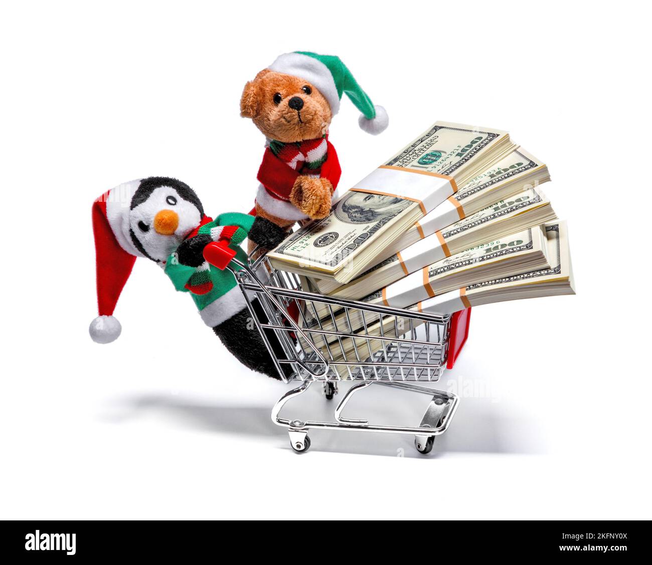 Santa's helpers with a shopping cart full of money. Funny Christmas concept Stock Photo
