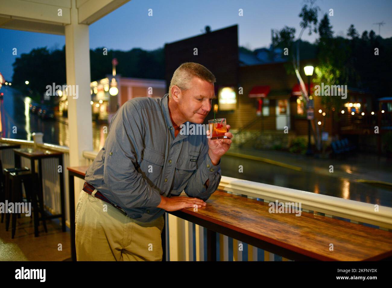 Man enjoying an 'old fashioned' cocktail made with whiskey at Sister Bay Bowl Supper Club and Restaurant, Door County, Sister Bay, Wisconsin, USA Stock Photo