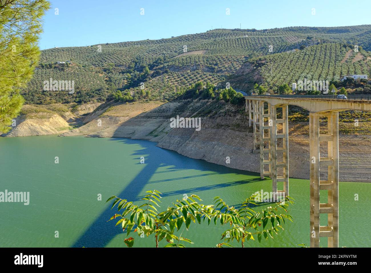 Drought conditions showing exposed Iznajar bridge in water level at 15% in Iznajar Embalse, the largest reservoir in Andalucia, Spain Stock Photo