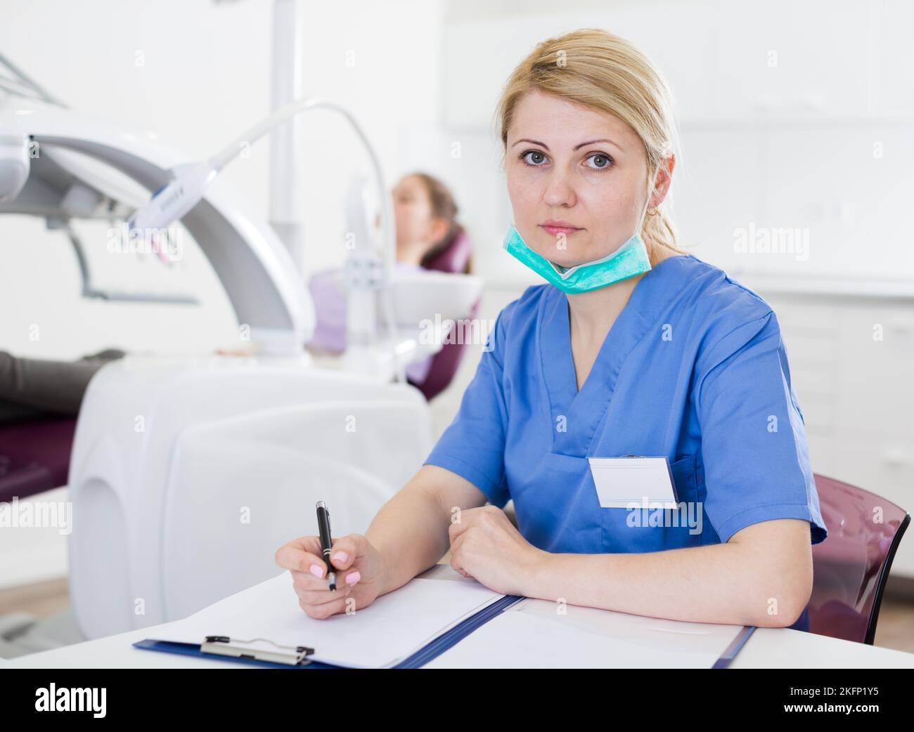 Female dentist working with medical records Stock Photo Alamy