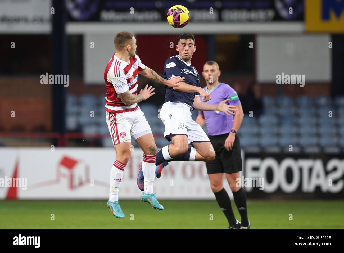 19th November 2022; Dens Park, Dundee, Scotland: Scottish Championship Football, Dundee versus Hamilton Academical; Shaun Byrne of Dundee competes in the air with Scott Martin of Hamilton Academical Stock Photo