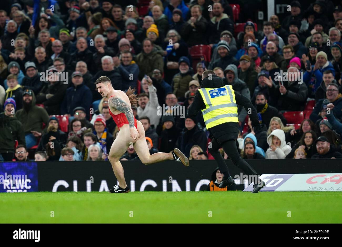 A streaker evades a steward during the Rugby League World Cup final at