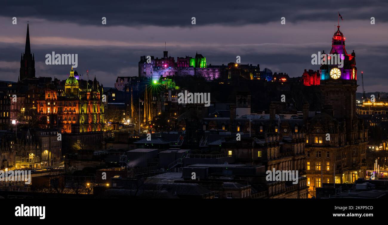 Edinburgh, Scotland, UK, 19th November 2022. Castle of Light: the annual Christmas light show at Edinburgh Castle lights up the city skyline at night with the Balmoral Hotel clock tower and the HBoS bank headquarters on The Mound also lit up in colourful lights. Credit: Sally Anderson/Alamy Live News Stock Photo