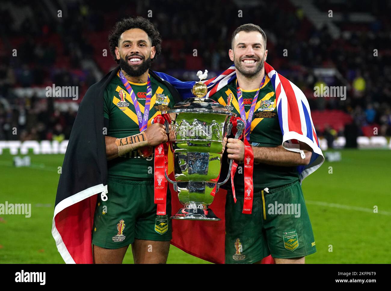 Australia's Josh Addo-Carr (left) and James Tedesco celebrate with the trophy after victory in the Rugby League World Cup final at Old Trafford, Manchester. Picture date: Saturday November 19, 2022. Stock Photo