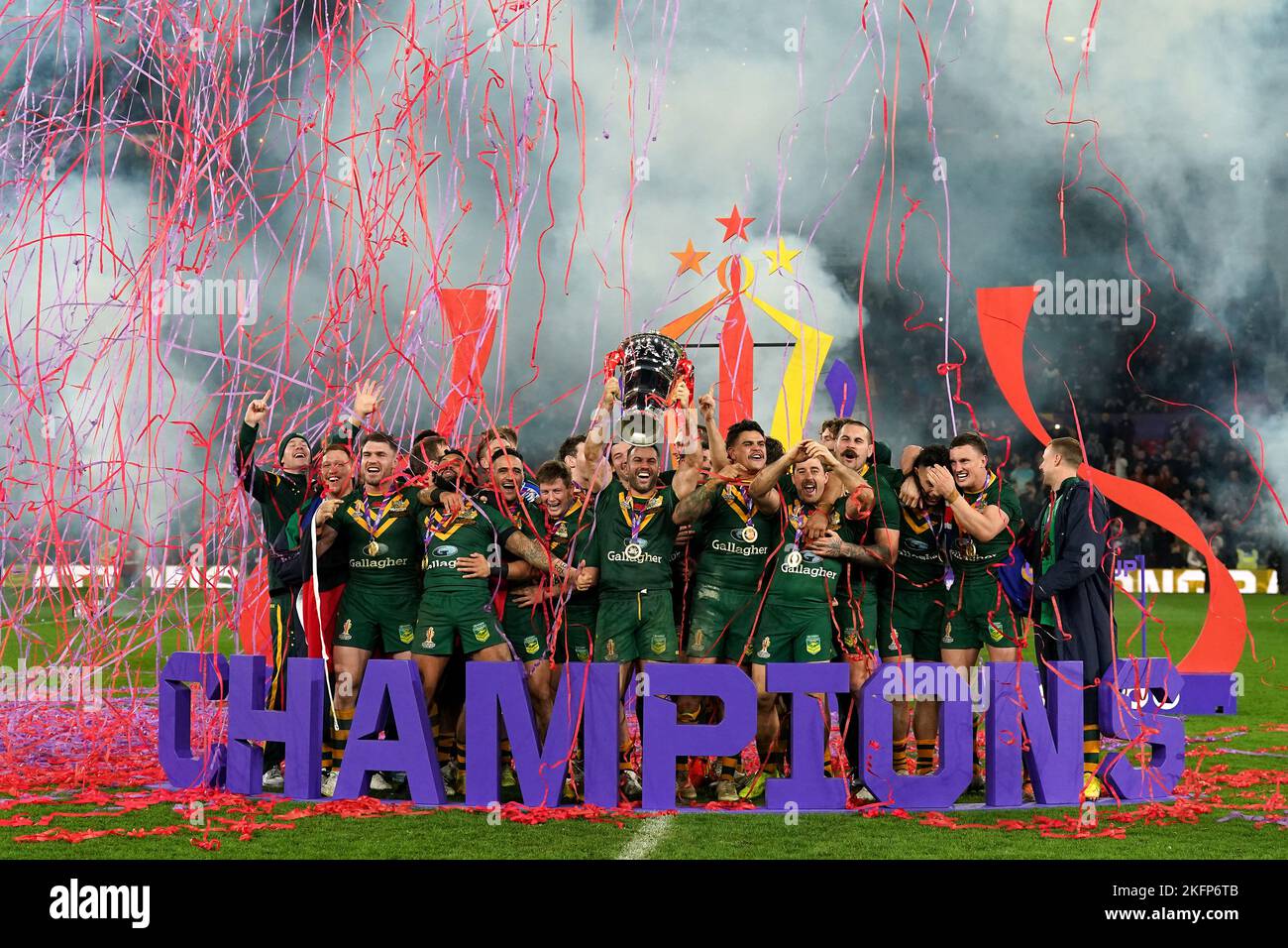 Australia's James Tedesco (centre) lifts the trophy with team-mates after victory in the Rugby League World Cup final at Old Trafford, Manchester. Picture date: Saturday November 19, 2022. Stock Photo