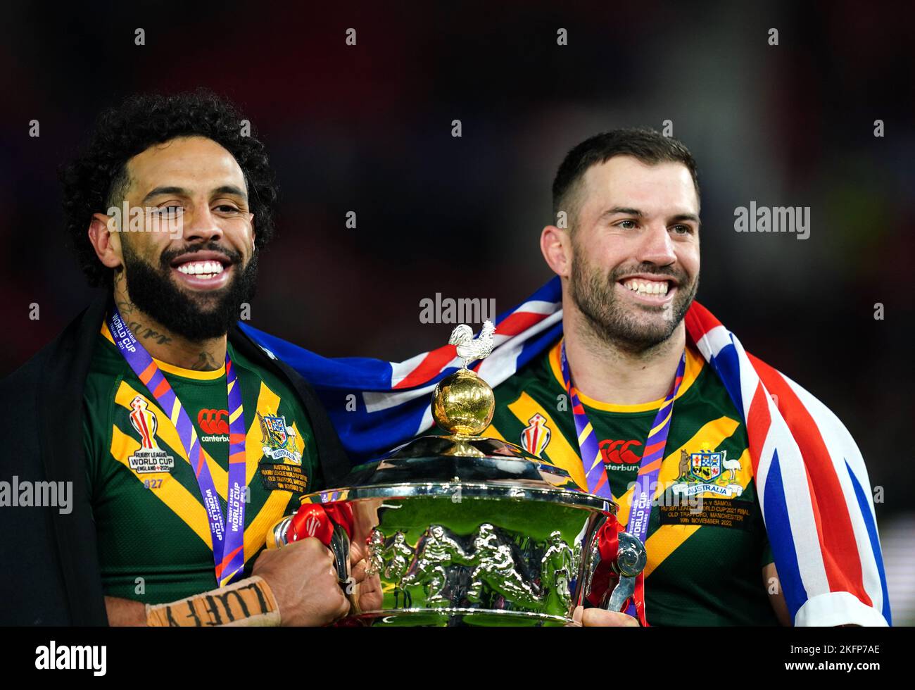 Australia's Josh Addo-Carr (left) and Australia's James Tedesco celebrate with the trophy following the Rugby League World Cup final at Old Trafford, Manchester. Picture date: Saturday November 19, 2022. Stock Photo